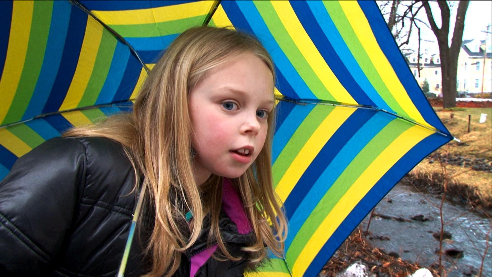  Ella and her dad as they track melted snow.