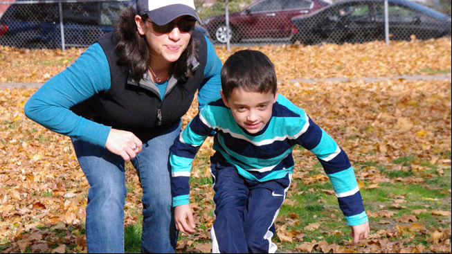 Mom and son tiptoe