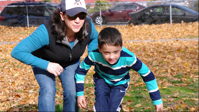 Mom and son tiptoe