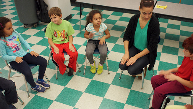 Teacher with students
