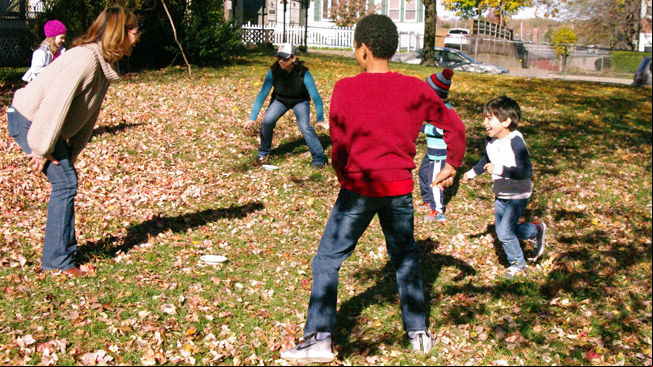 Children and adults play
tag