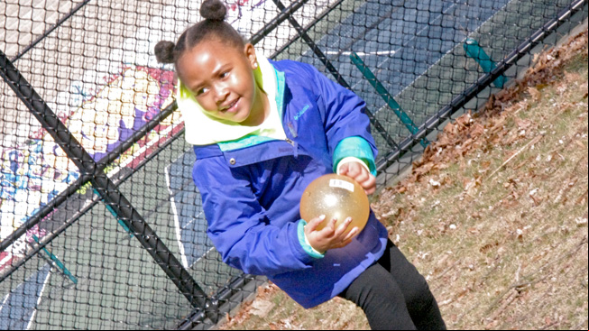 Girl standing with ball