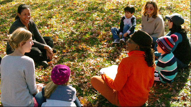Educators talk with group