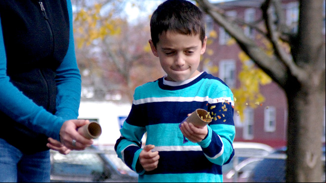 Boy and mom shoot seeds