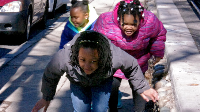 Three girls dodge sun