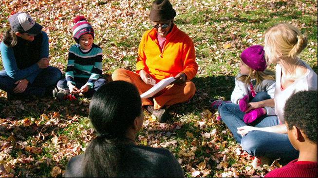Educator talks with group