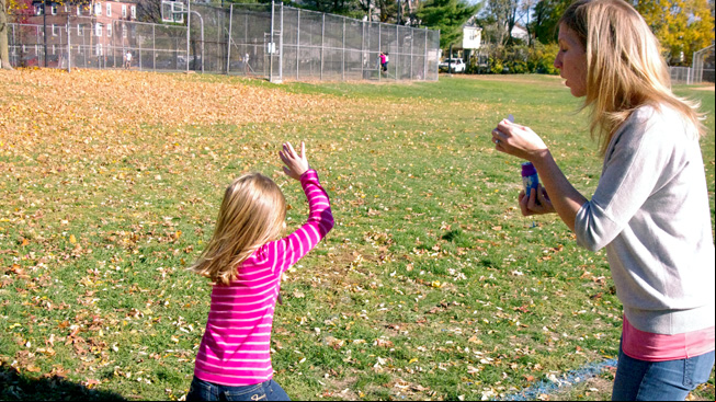 Family blowing
bubbles